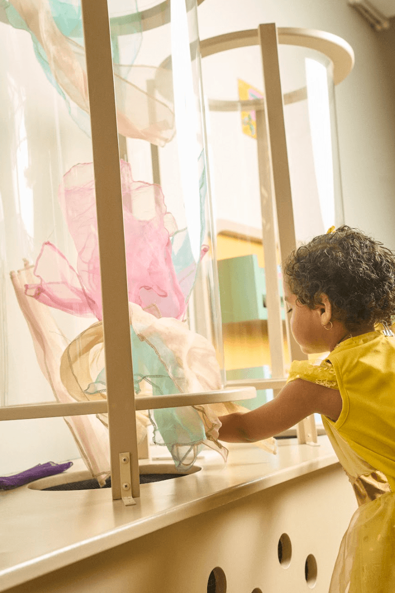 Child exploring the play café during a birthday party